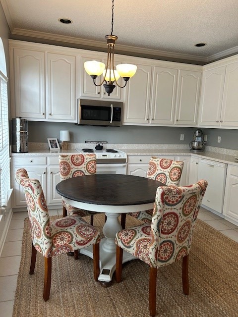 1698 Pin Oak Dr Unit 128, Dalton, GA 30721 - dining space with light tile patterned floors, crown molding, a chandelier, and a textured ceiling