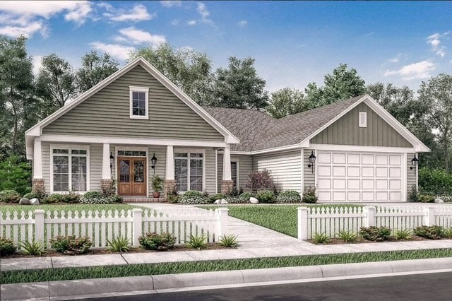 view of front of home with a garage, a fenced front yard, board and batten siding, and concrete driveway