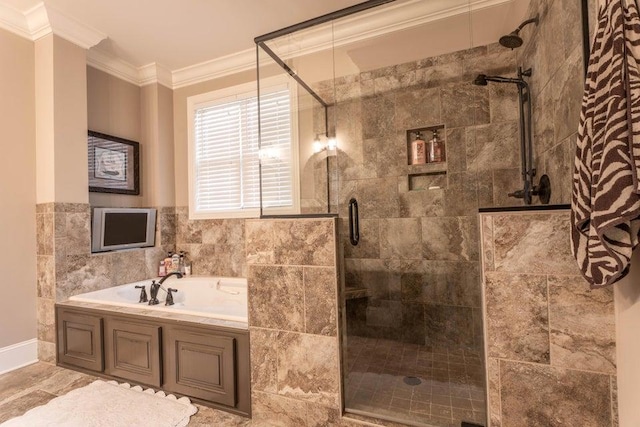 bathroom featuring a stall shower, ornamental molding, and a garden tub