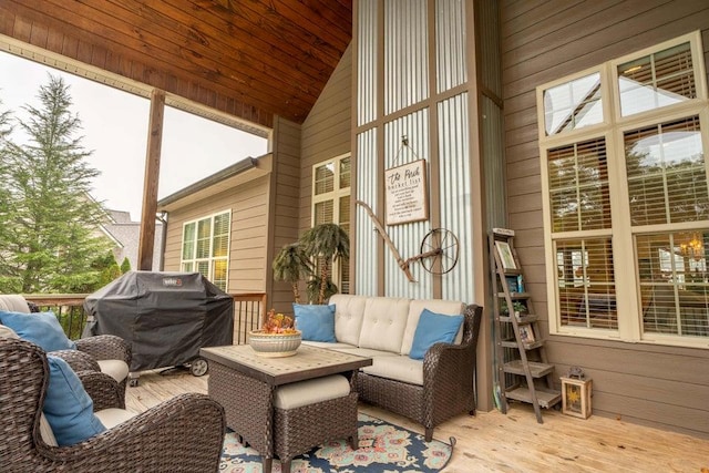 sunroom / solarium featuring lofted ceiling and wooden ceiling