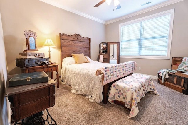 bedroom featuring carpet flooring, ornamental molding, visible vents, and ceiling fan