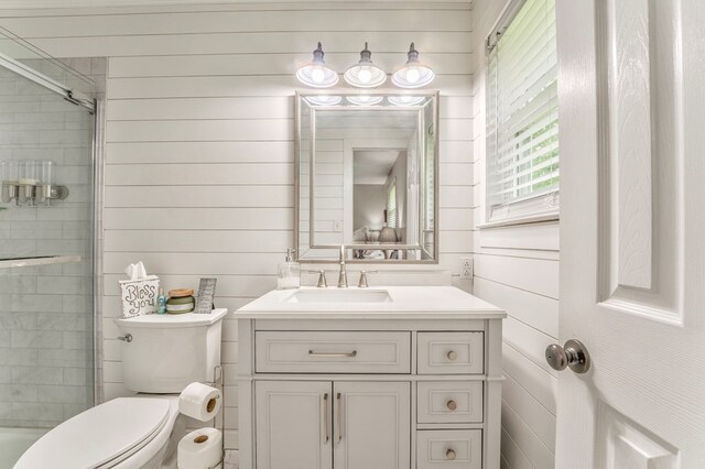 3012 Brookhaven Cir, Dalton, GA 30720 - full bathroom featuring wooden walls, toilet, a shower with shower door, and vanity