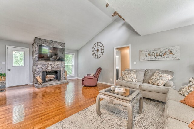 3012 Brookhaven Cir, Dalton, GA 30720 - living room featuring a stone fireplace, baseboards, wood finished floors, and a wealth of natural light