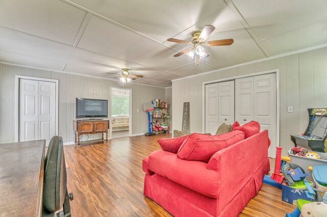3012 Brookhaven Cir, Dalton, GA 30720 - living area featuring a ceiling fan, wood finished floors, wood walls, and ornamental molding