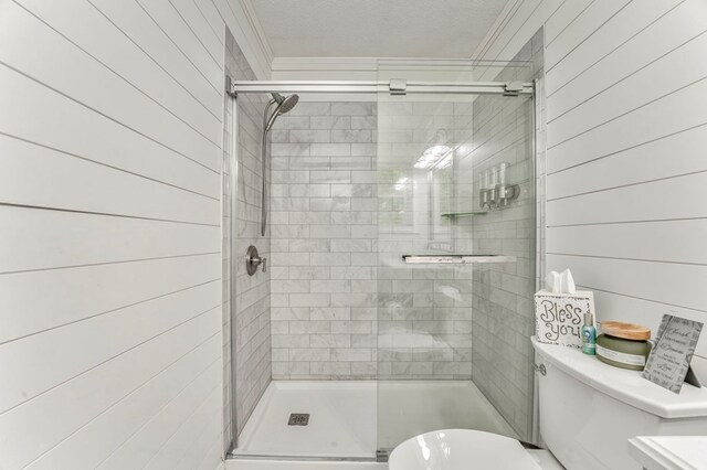 3012 Brookhaven Cir, Dalton, GA 30720 - full bath featuring wooden walls, crown molding, toilet, a textured ceiling, and a shower stall