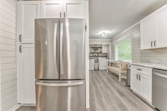 3012 Brookhaven Cir, Dalton, GA 30720 - kitchen featuring light wood-style flooring, white cabinetry, appliances with stainless steel finishes, and washer and dryer