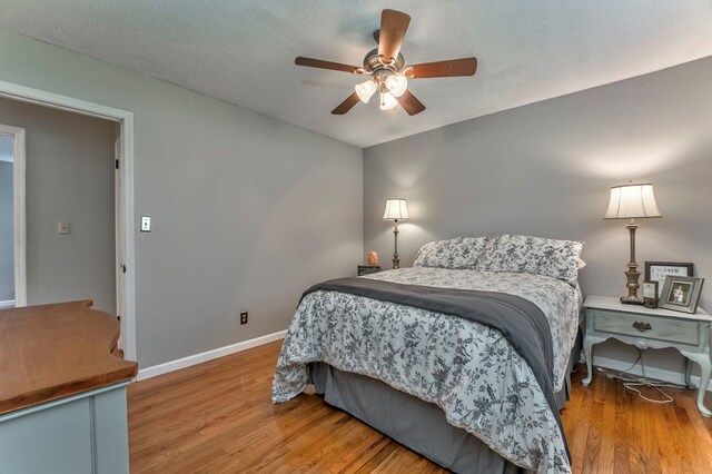 3012 Brookhaven Cir, Dalton, GA 30720 - bedroom with baseboards, ceiling fan, and wood finished floors