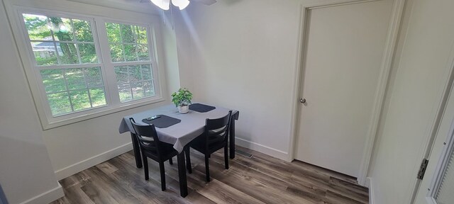 dining space with dark hardwood / wood-style floors