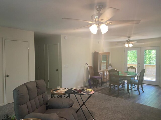 living room featuring hardwood / wood-style flooring, french doors, and ceiling fan