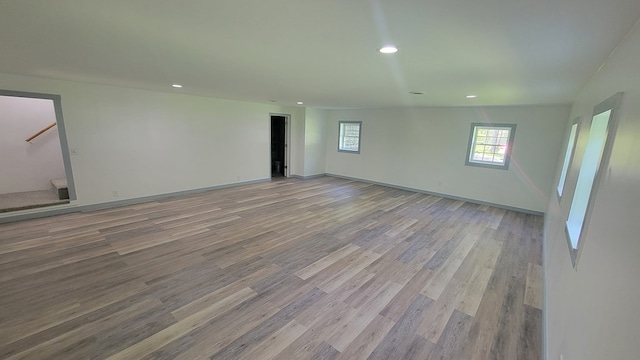 unfurnished room with light wood-type flooring