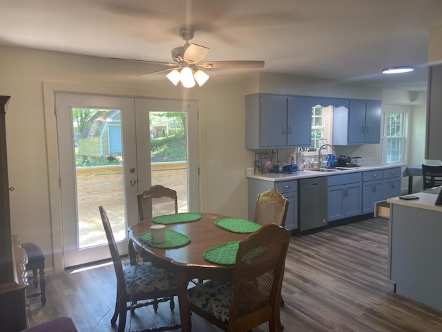 dining area featuring french doors, dark hardwood / wood-style flooring, and sink