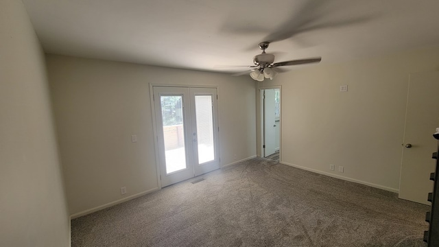 unfurnished room featuring carpet flooring, ceiling fan, and french doors