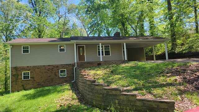 view of front of home with a carport