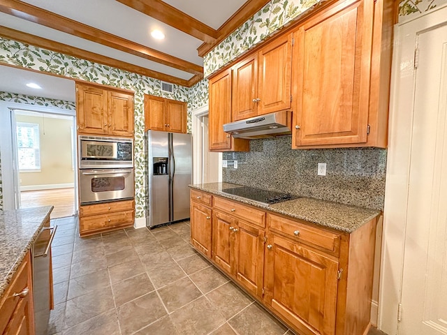 kitchen with beamed ceiling, stainless steel appliances, decorative backsplash, and stone counters