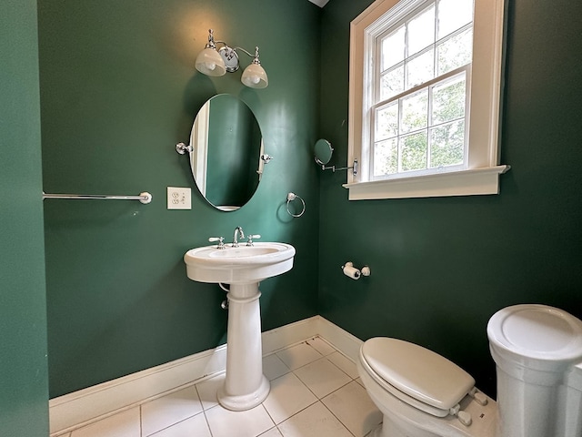 bathroom featuring tile patterned floors and toilet