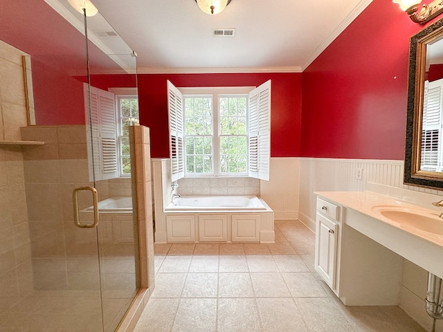 bathroom featuring crown molding, vanity, and separate shower and tub