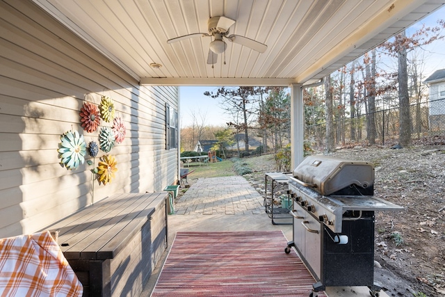 wooden deck featuring a patio, fence, area for grilling, and ceiling fan