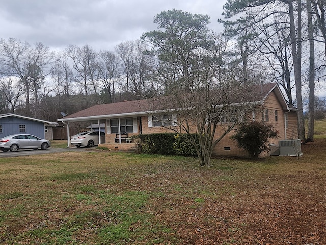 single story home with a carport and a front yard