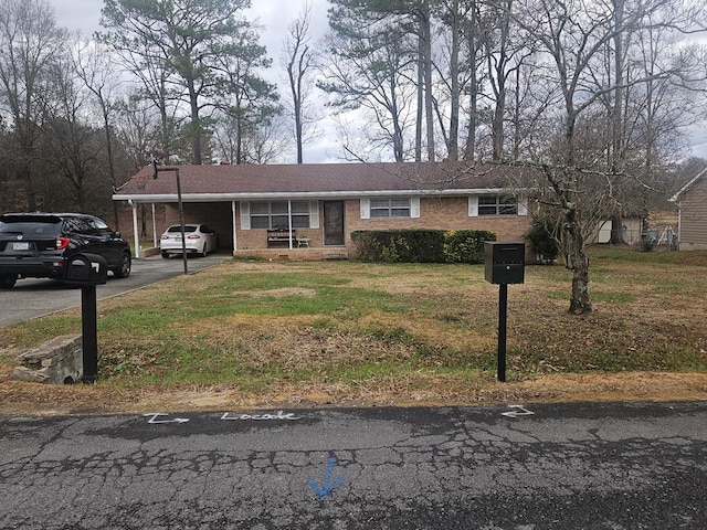 view of front of property with a carport and a front yard