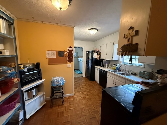 kitchen with sink, a textured ceiling, white cabinets, light parquet floors, and black appliances