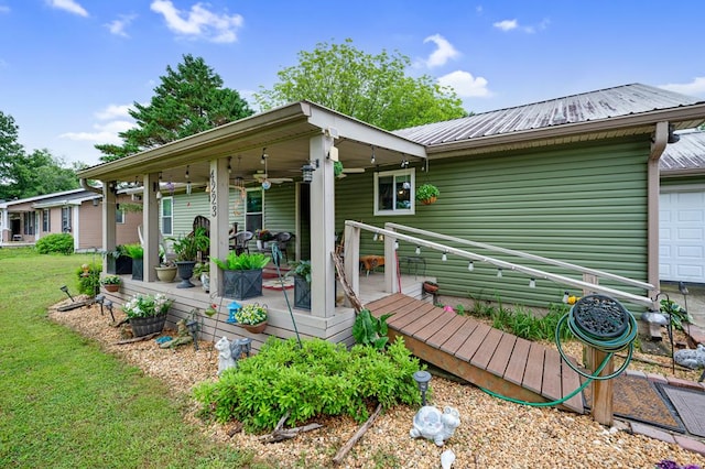4223 Spring Valley Dr, Cohutta, GA 30710 - view of front facade featuring a ceiling fan, metal roof, and a front lawn