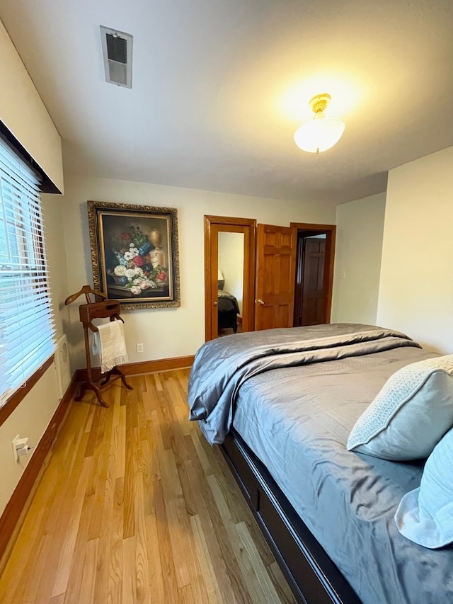 bedroom featuring wood-type flooring