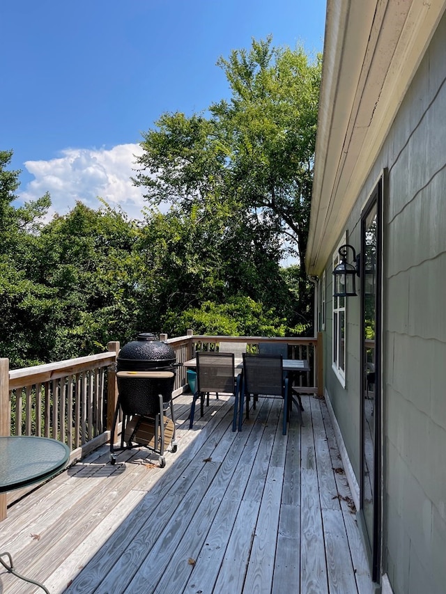 wooden deck with grilling area