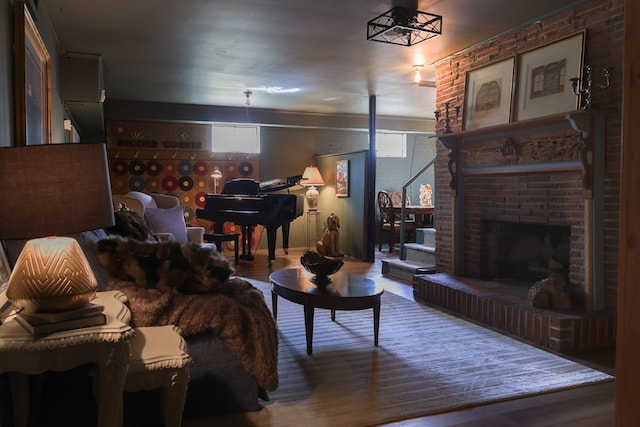 702 Lumpkin St, Dalton, GA 30720 - living room featuring wood finished floors and a brick fireplace
