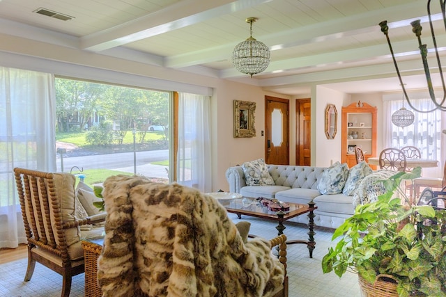 702 Lumpkin St, Dalton, GA 30720 - living room with beam ceiling, healthy amount of natural light, and a chandelier