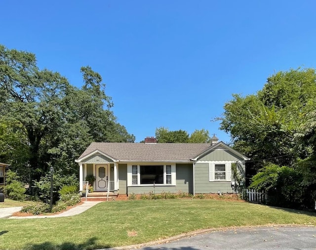 ranch-style home with a front yard