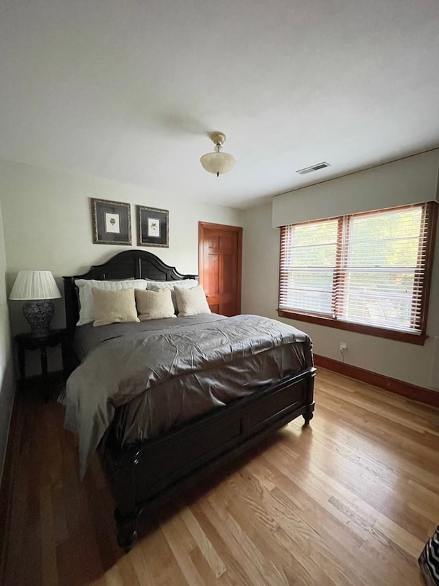 bedroom with light hardwood / wood-style floors