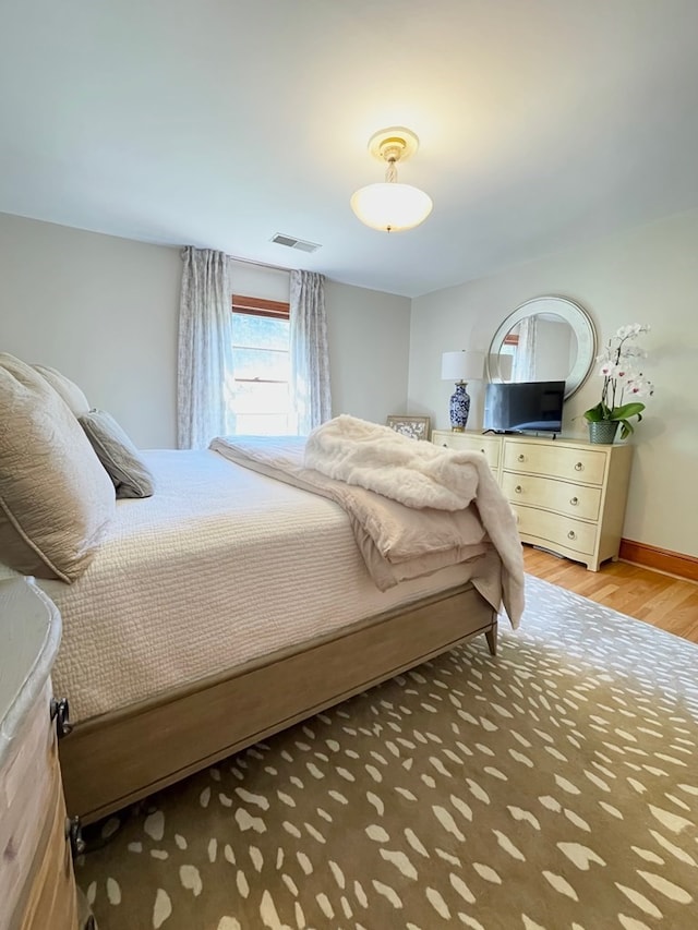 bedroom featuring hardwood / wood-style floors