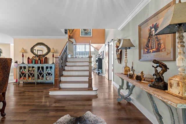 entryway with ornamental molding and dark hardwood / wood-style flooring