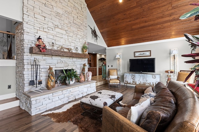 living room with wood-type flooring, a stone fireplace, high vaulted ceiling, and wooden ceiling