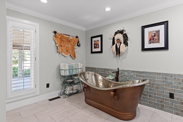 interior space with tile patterned flooring, crown molding, and a tub