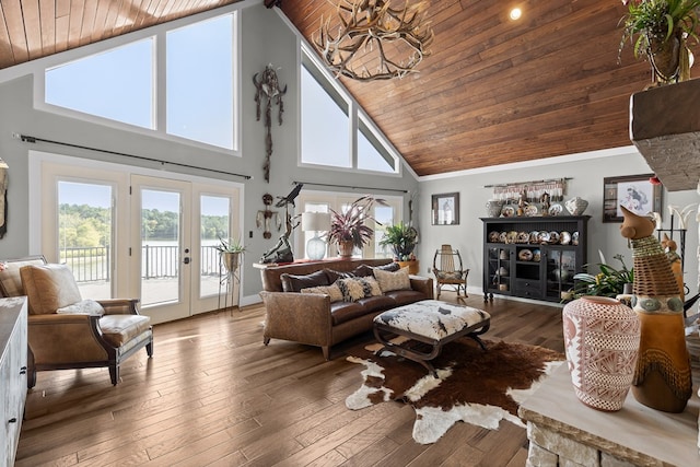 living room with hardwood / wood-style flooring, high vaulted ceiling, french doors, and wooden ceiling