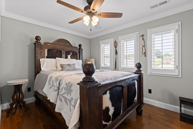 bedroom featuring crown molding, ceiling fan, and dark hardwood / wood-style flooring