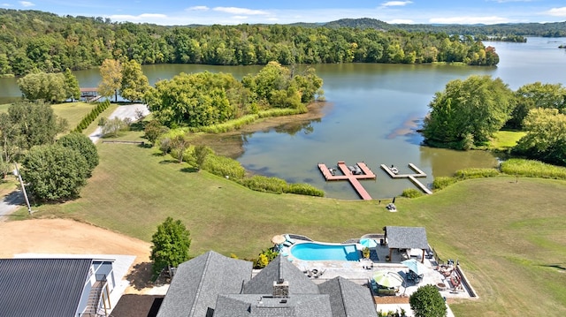 birds eye view of property with a water view