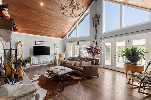 living room featuring high vaulted ceiling, wood-type flooring, wood ceiling, crown molding, and french doors