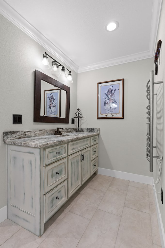 bathroom featuring crown molding, vanity, and tile patterned floors