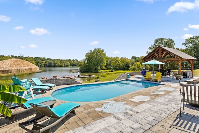 view of swimming pool featuring a gazebo, a patio, and a water view