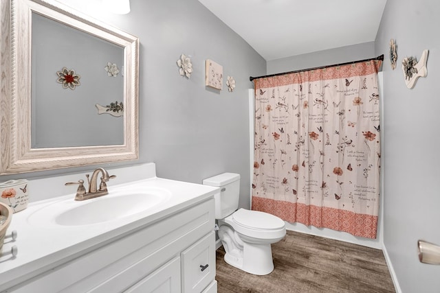 full bathroom with shower / bath combination with curtain, wood-type flooring, toilet, and vanity