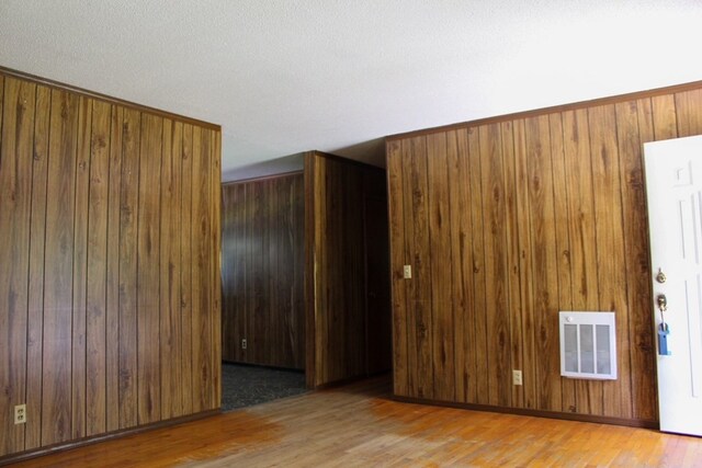 1722 Ball Ave, Dalton, GA 30720 - empty room with wood finished floors and wood walls