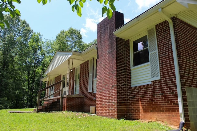 1722 Ball Ave, Dalton, GA 30720 - view of side of home featuring a chimney and brick siding