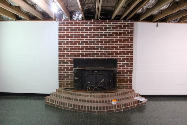 1722 Ball Ave, Dalton, GA 30720 - basement view of tile patterned floors, a brick fireplace, and baseboards