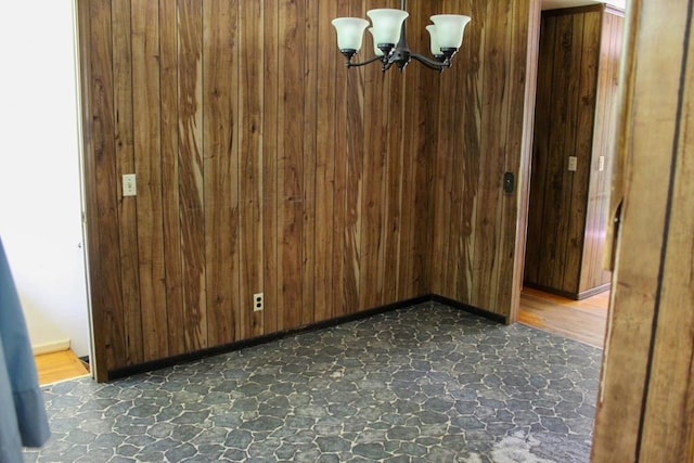 1722 Ball Ave, Dalton, GA 30720 - unfurnished dining area with wooden walls and a chandelier