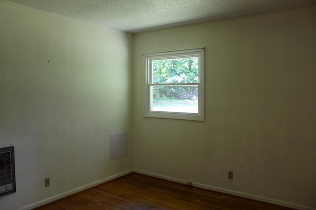 1722 Ball Ave, Dalton, GA 30720 - unfurnished room with dark wood finished floors, baseboards, and a textured ceiling