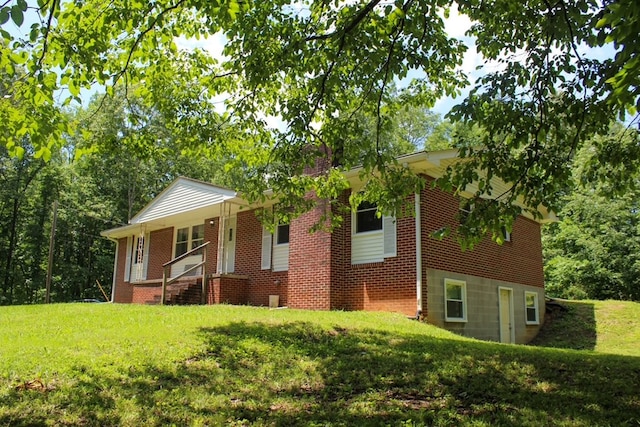 1722 Ball Ave, Dalton, GA 30720 - view of front of house featuring a front yard, brick siding, and a porch