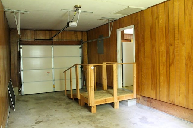 1722 Ball Ave, Dalton, GA 30720 - garage featuring wooden walls, a garage door opener, freestanding refrigerator, and electric panel
