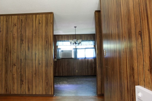 1722 Ball Ave, Dalton, GA 30720 - spare room with a chandelier, cooling unit, and wood finished floors